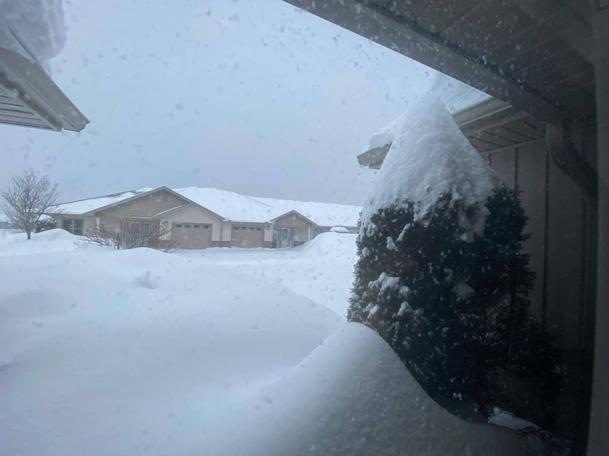 Snow accumulates outside homes in Kincardine, Ont. on Feb. 16, 2025.