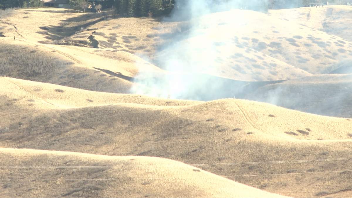 Smoke seen rising from a fire in the Old Man River valley just west of Scenic Drive in Lethbridge on Friday.