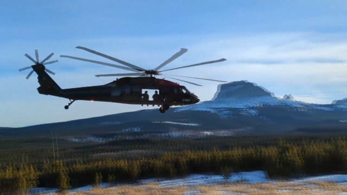 An RCMP black hawk helicopters is seen conducting patrols along the Canada- U.S. border near Coutts, Alberta where it began operations in late January.