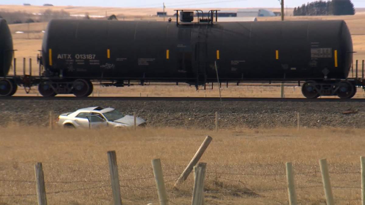 RCMP say a woman was killed Thursday afternoon in a collision between a vehicle and a train northwest of Airdrie.