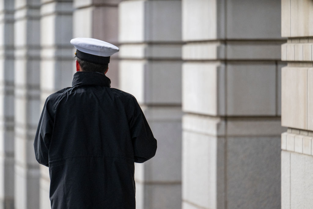 A member of the US military stands outside the William B. Bryant Annex of the US Courthouse in Washington, DC, on February 18, 2025.