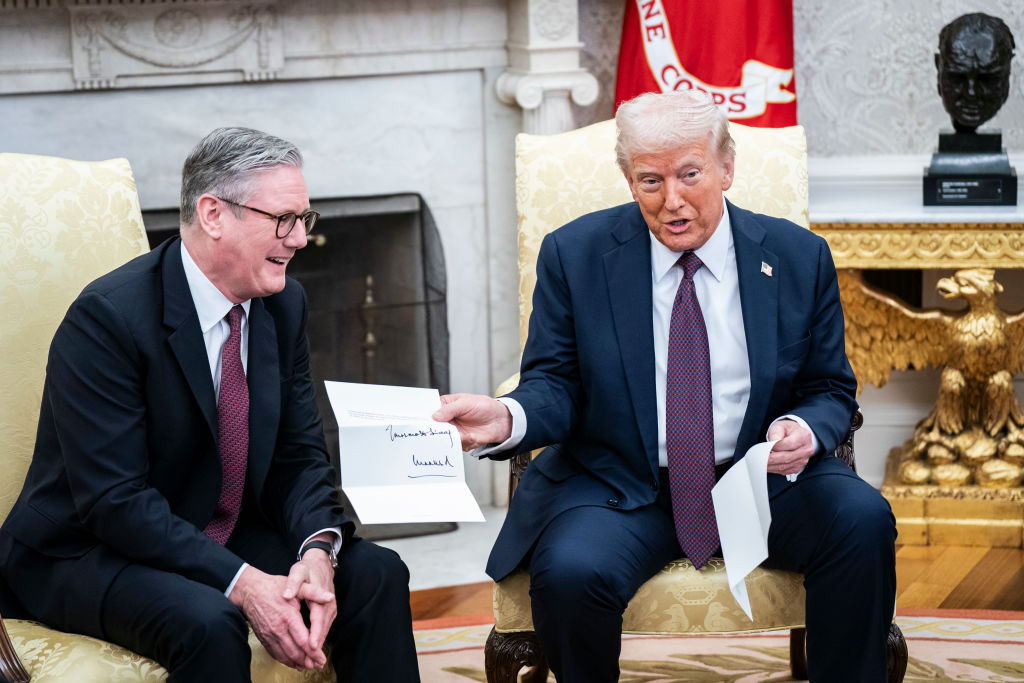 President Donald J Trump is given a letter from King Charles III, by British Prime Minister Keir Starmer in the Oval Office at the White House on Thursday, Feb 27, 2025 in Washington, DC.