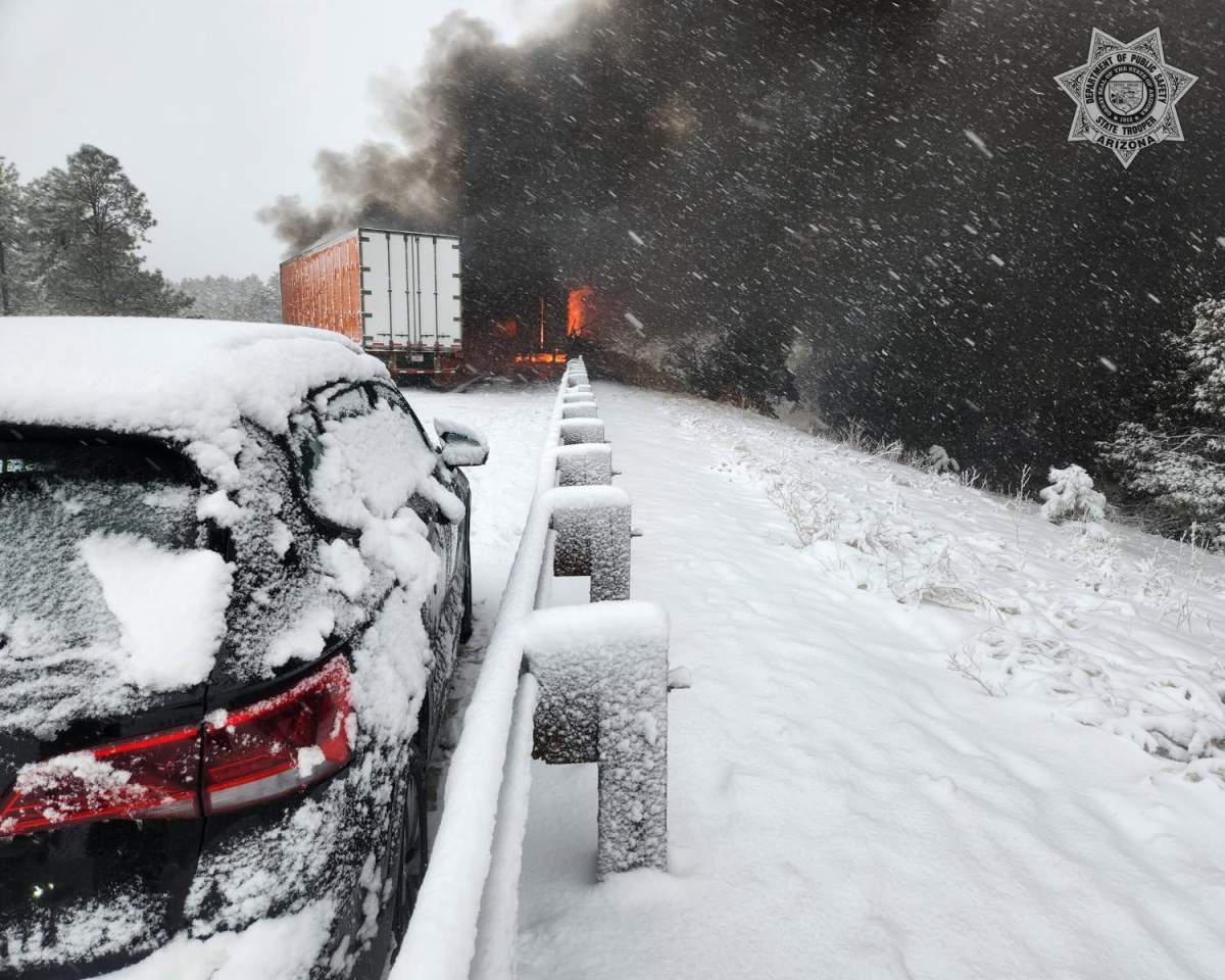 Smoke rises from a fire caused by a 22 vehicle pile up on the I-40 westboud on March 13, 2025.