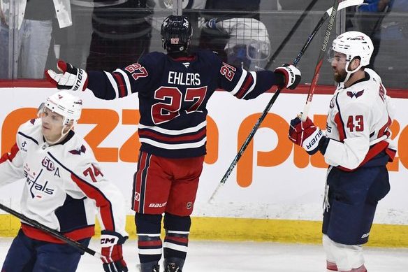 <p>Winnipeg Jets' Nikolaj Ehlers (27) celebrates his game-winning goal in overtime against the Washington Capitals during their NHL hockey game in Winnipeg, Tuesday March 25 2025. THE CANADIAN PRESS/Fred Greenslade</p>.