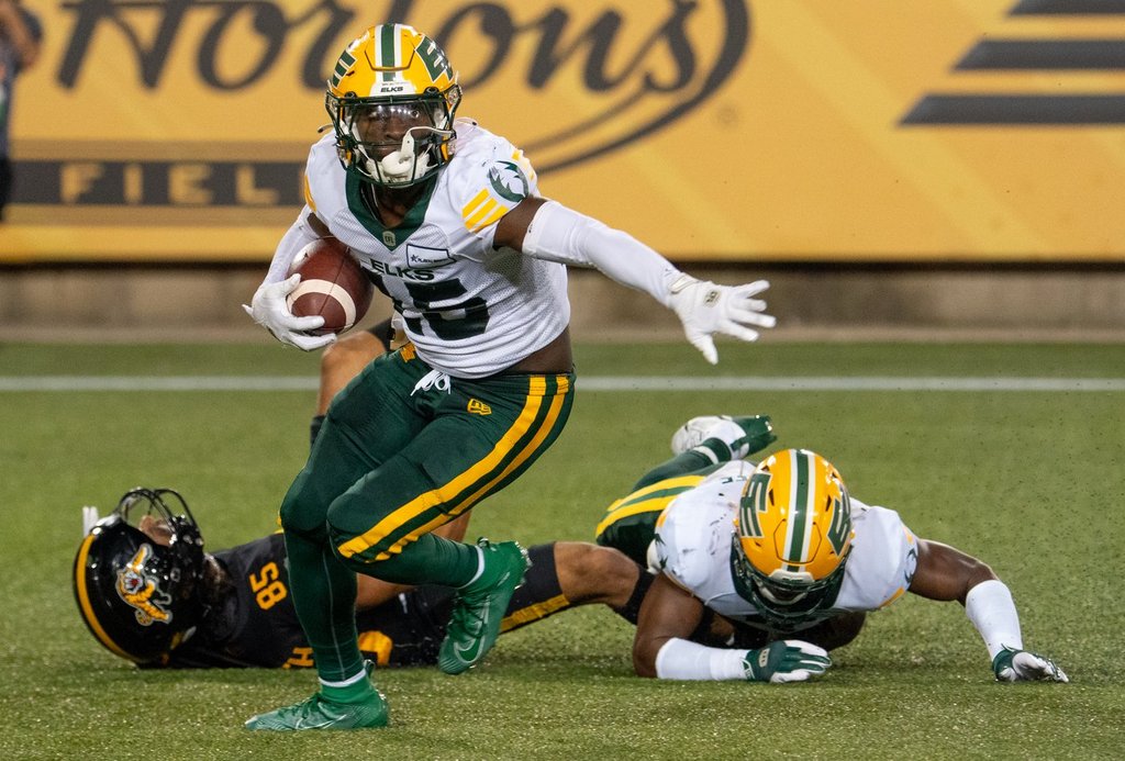 Edmonton Elks defensive back Kordell Jackson turns to run after making an interception during second half CFL football game action against the Hamilton Tiger-Cats in Hamilton, Ont. on Saturday, Aug. 17, 2024. A big part of GM Ed Hervey's off-season was shoring up an Elks defence that last season was last in offensive yards (394.6 yards per game) and passing yards (313.4 yards) allowed per game and second-last overall in touchdowns surrendered (54).