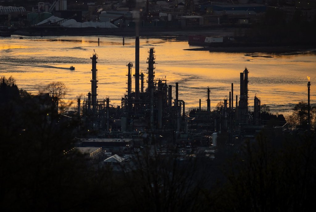 A shareholder in Parkland Corp. is demanding a board shakeup at the Calgary-based fuel refiner and retailer. A boat travels past the Parkland Burnaby Refinery on Burrard Inlet at sunset in Burnaby, B.C., on Saturday, April 17, 2021.