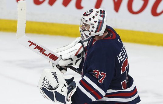 Winnipeg Jets goaltender Connor Hellebuyck (37) celebrates a shutout win against New Jersey Devils in NHL action in Winnipeg on Friday, March 28, 2025.