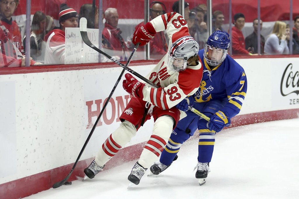 Ohio St. defenceman Damien Carfagna (93) and Lake Superior St. forward Branden Piku (7) battle for control of the puck during an NCAA hockey game on Saturday, Nov. 2, 2024, in Columbus, Ohio.