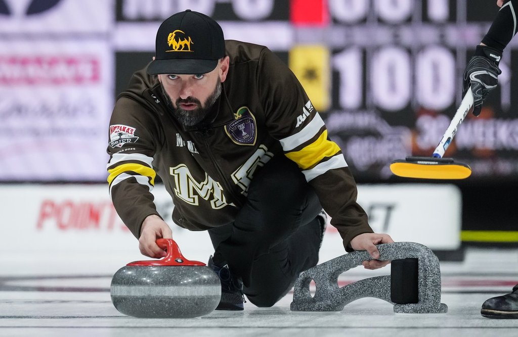 Manitoba-Carruthers skip Reid Carruthers delivers a rock while playing New Brunswick during the Brier, in Kelowna, B.C., on Monday, March 3, 2025. THE CANADIAN PRESS/Darryl Dyck.