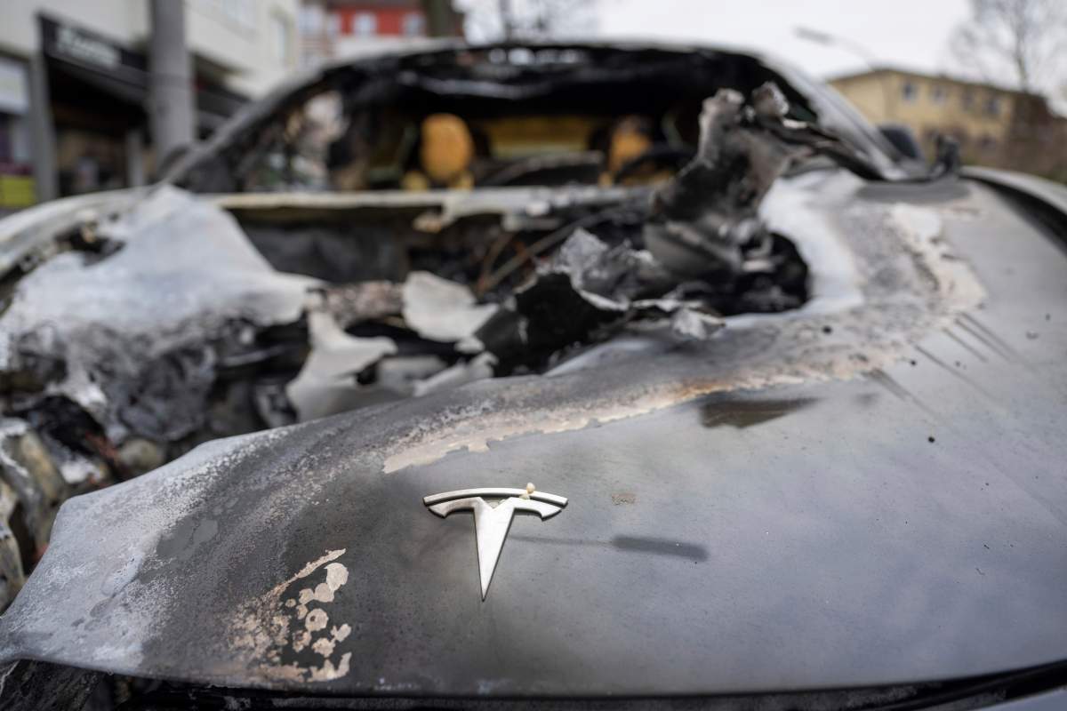 A burnt-out Tesla car stands in the Steglitz district of Berlin, Friday, March 14, 2025, as four Teslas are suspected to have been set on fire in Berlin.