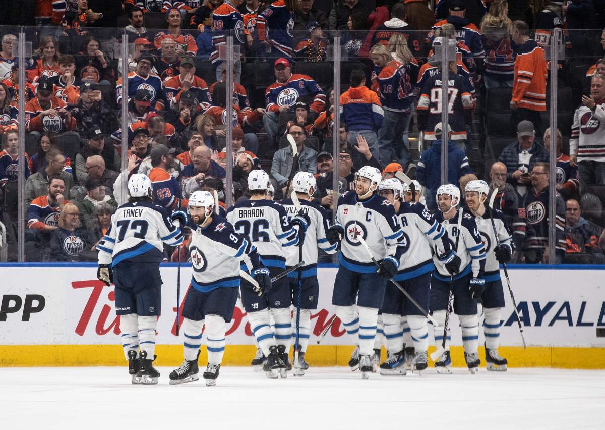 Winnipeg Jets players celebrate the win over the Edmonton Oilers during overtime NHL action in Edmonton on Thursday, March 20, 2025. THE CANADIAN PRESS/Jason Franson.