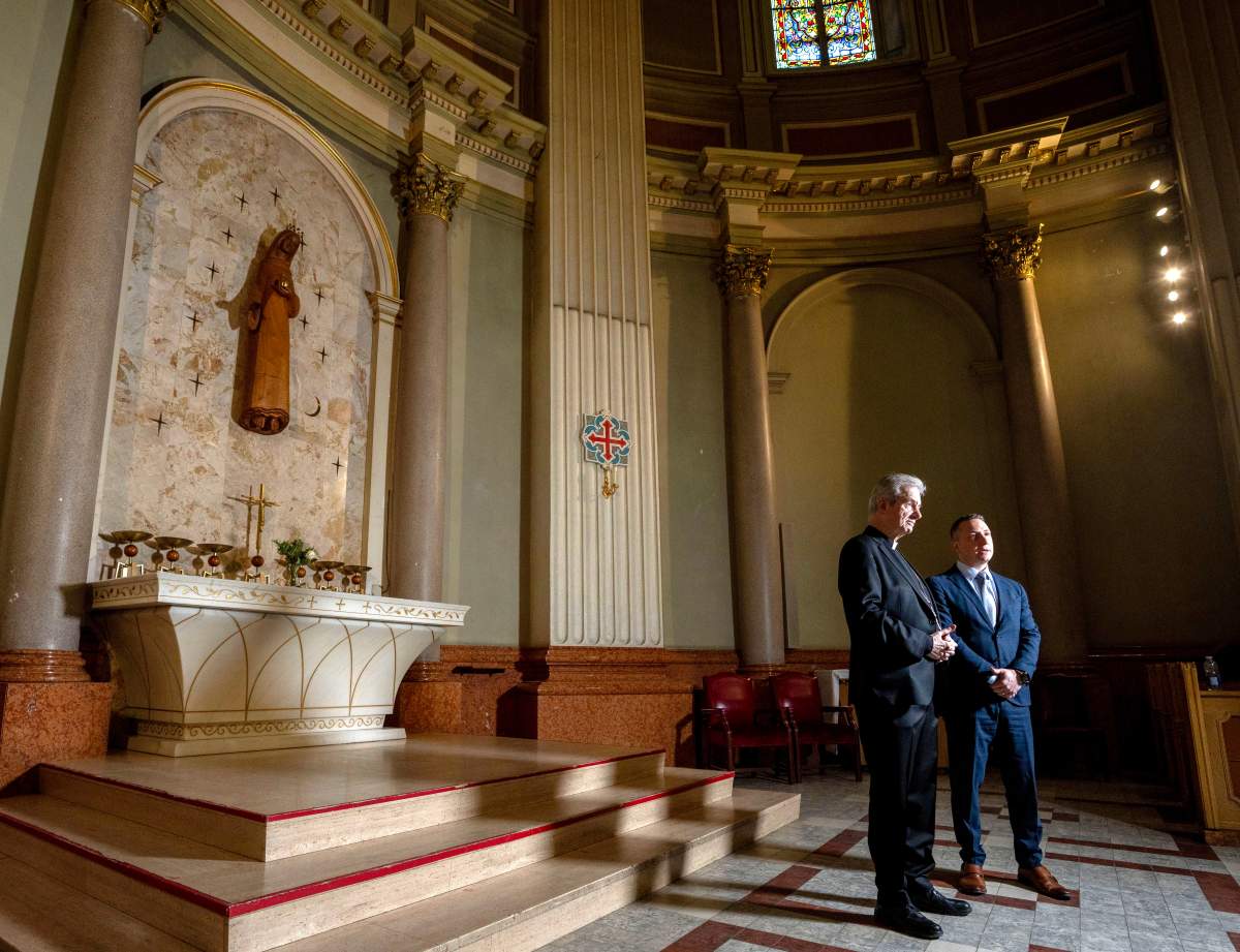 Christian Lepine, left, Archbishop of Montreal and Stefano  Marrone, head of real estate for the archdiocese of Montreal, speak during an interview in Mary Queen of the World Cathedral in Montreal on Wednesday, March 26, 2025. 
