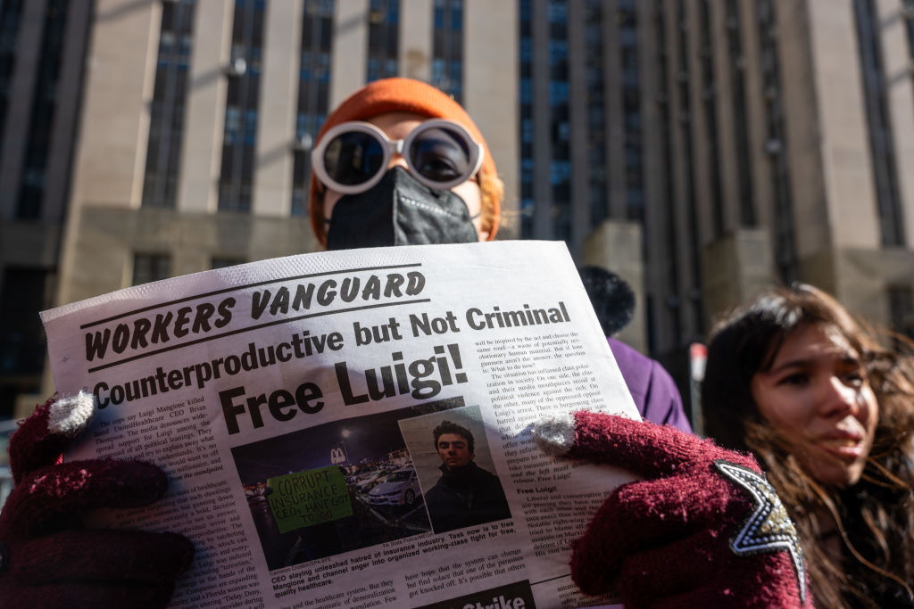 Supporters of Luigi Mangione, the 26-year-old accused of killing UnitedHealthcare CEO Brian Thompson, gather outside of Manhattan Criminal Court as Mangione was in court for a status hearing on February 21, 2025, in New York City. (Spencer Platt/Getty Images)