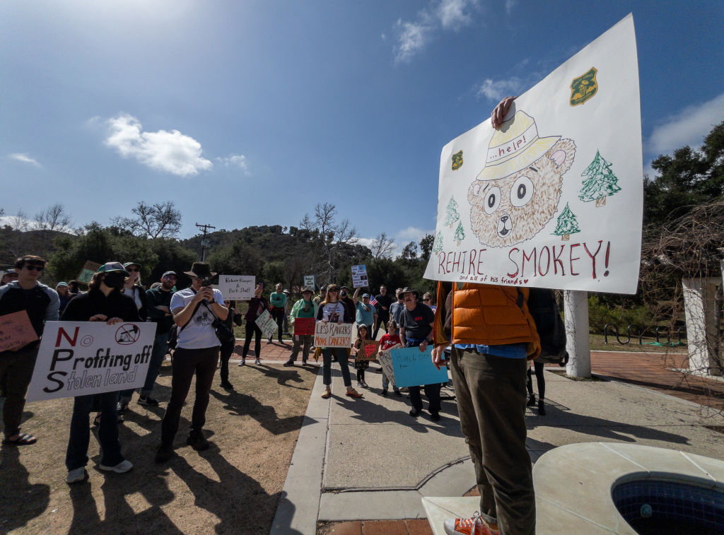 Cris Graves, right, organized the Protect the Parks protest that attracted over 100 to the Anthony C. Beilenson Interagency Visitor Center at King Gillette Ranch in Calabasas, Calif., on Saturday, March 1, 2025.