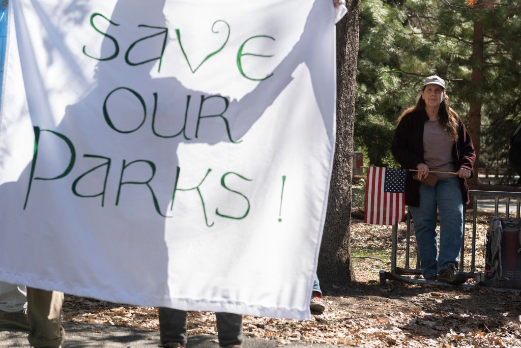 People demonstrate during a protest against federal employee layoffs at Yosemite National Park, California on March 1, 2025.