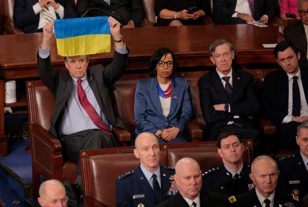 U.S. Sen. Jeff Merkley (D-OR) holds up a Ukraine flag as U.S. President Donald Trump addresses a joint session of Congress at the U.S. Capitol on March 04, 2025 in Washington, DC. President Trump was expected to address Congress on his early achievements of his presidency and his upcoming legislative agenda. (Photo by Chip Somodevilla/Getty Images)