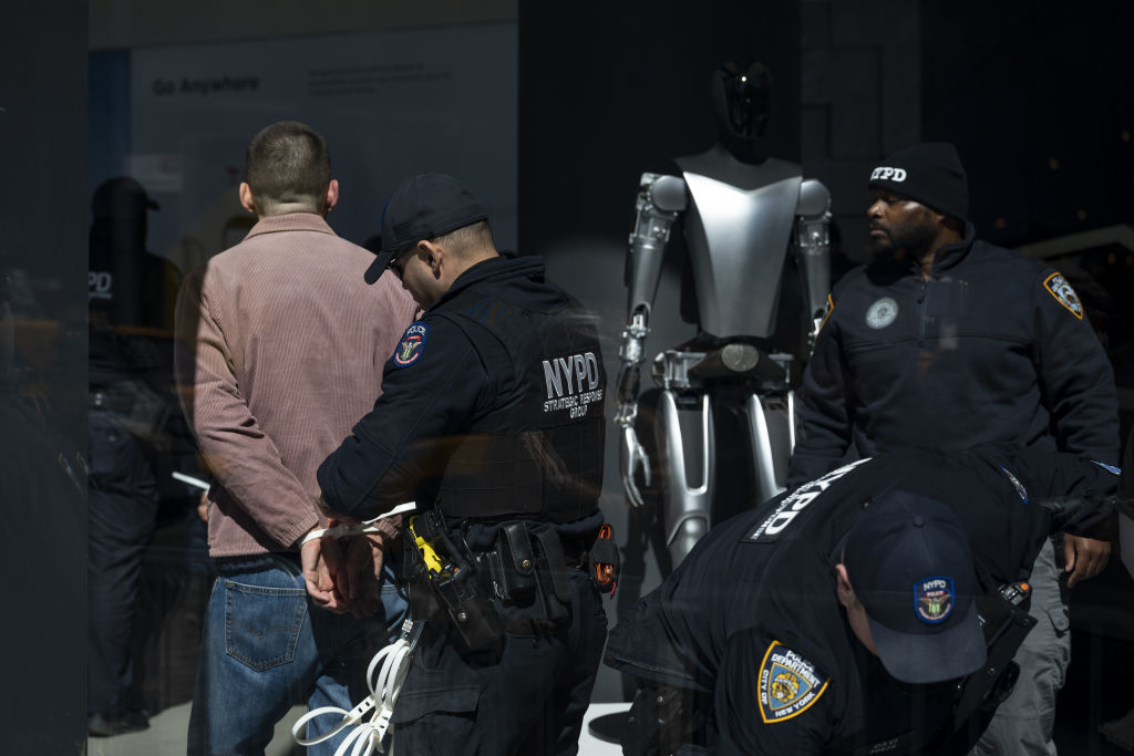 NYPD officers arrest protestors during 'TeslaTakedown' protest against Elon Musk outside a Tesla car dealership in New York City, United States on 8 March 2025. (Photo by Mostafa Bassim/Anadolu via Getty Images)