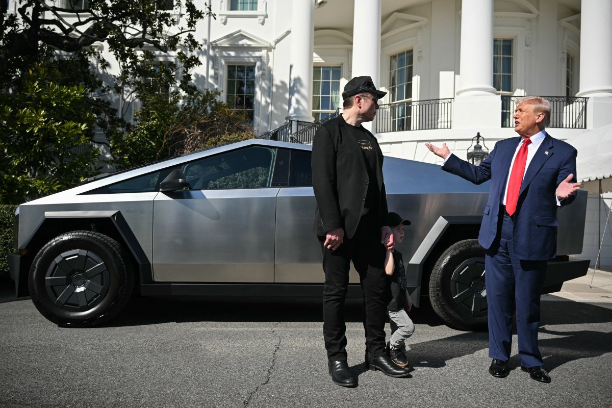 President Donald Trump and Tesla CEO Elon Musk speak to the press as they stand next to a Tesla Cybertruck on the South Portico of the White House on March 11, 2025 in Washington, DC. (Photo by Mandel NGAN / AFP) (Photo by MANDEL NGAN/AFP via Getty Images)