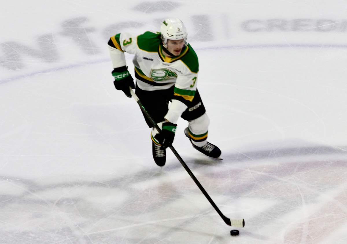 Sam Dickinson of the London Knights skates through centre in a game that saw his tie the London Knights record for most points by a defenceman in a single season.