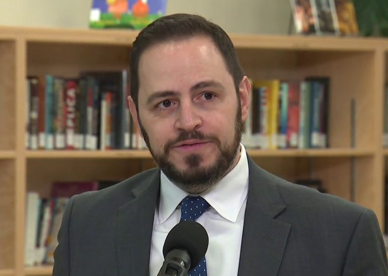 Education Minister Demetrios Nicolaides speaks at a news conference at St. Brendan Catholic Elementary/Junior High School in Edmonton on March 19, 2025.