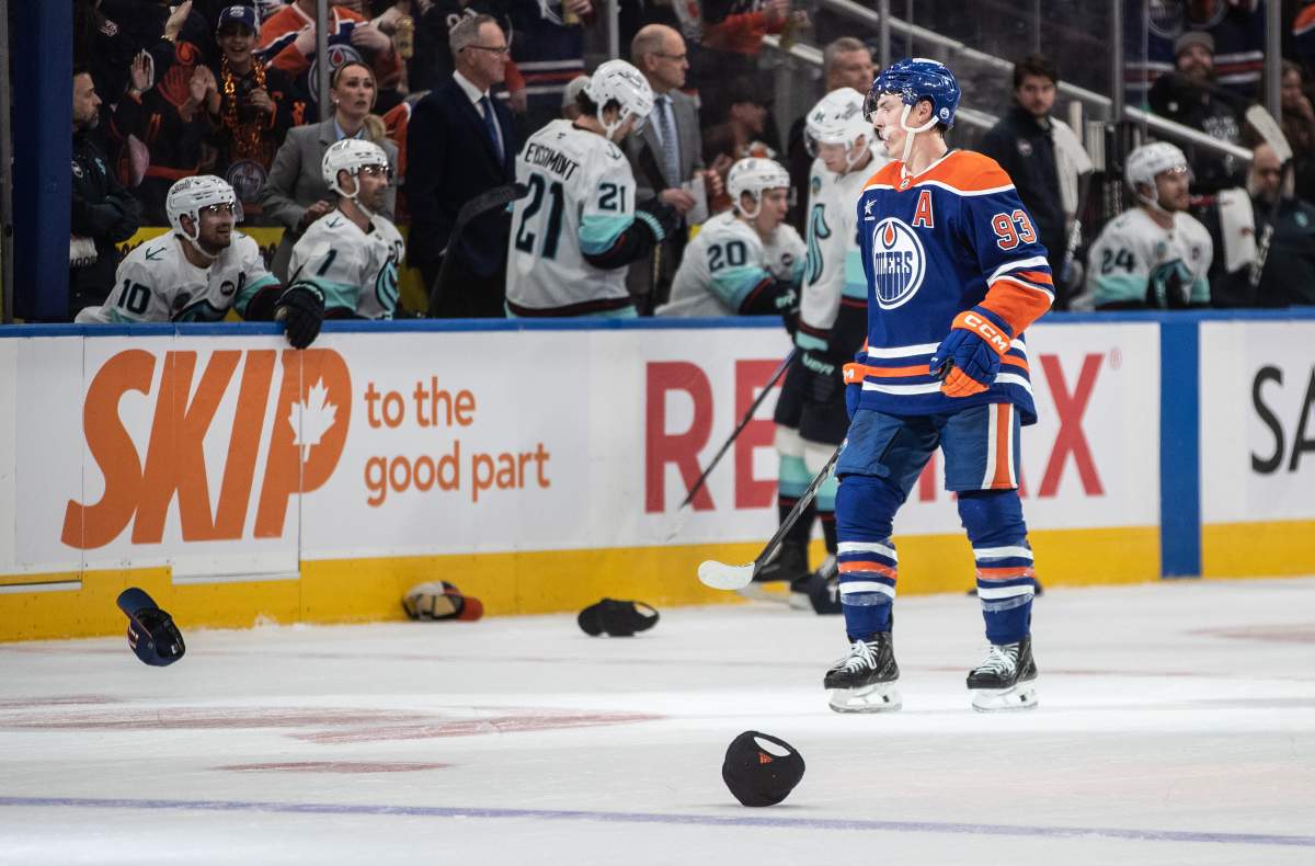 Edmonton Oilers' Ryan Nugent-Hopkins (93) celebrates his hat trick goal against the Seattle Kraken during third period NHL action in Edmonton on Saturday, March 22, 2025.