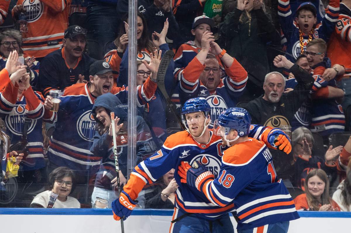 Edmonton Oilers' Connor McDavid (97) and Zach Hyman (18) celebrate a goal against the Dallas Stars during second period NHL action in Edmonton on Saturday, March 8, 2025.
