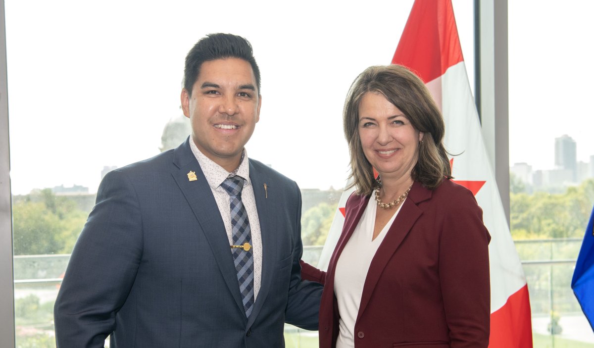 Lesser Slave Lake MLA Scott Sinclair sworn in as a parliamentary secretary and posing with Premier Danielle Smith in Edmonton on Thursday, August 17, 2023.