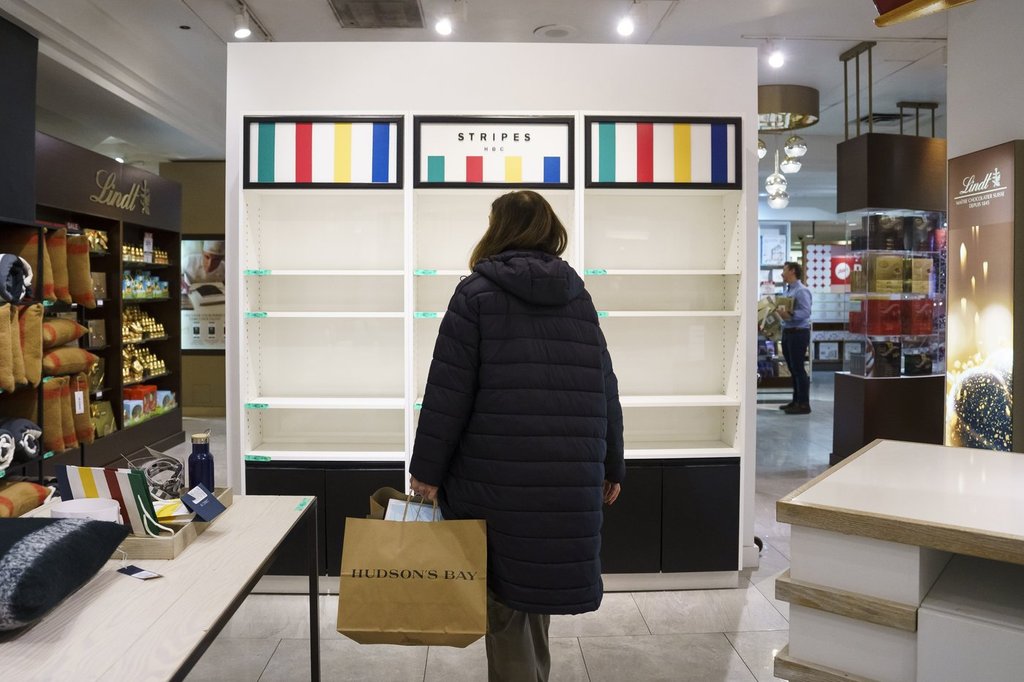 Shoppers browse a Hudson's Bay in Toronto on Monday, March 17, 2025.