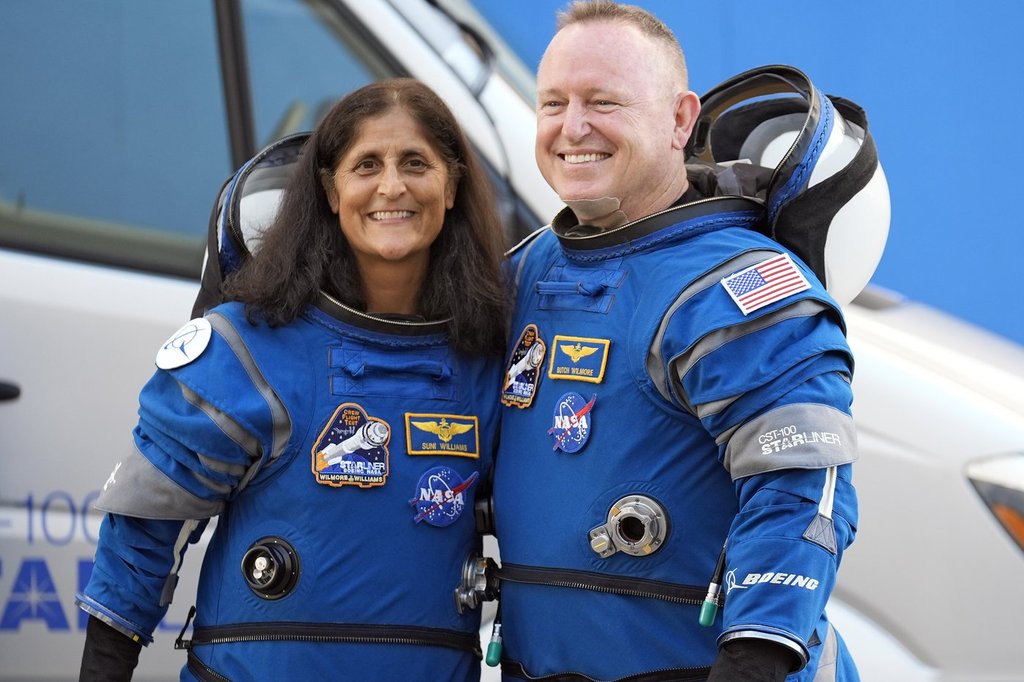FILE – NASA astronauts Suni Williams, left, and Butch Wilmore stand together for a photo enroute to the launch pad at Space Launch Complex 41 Wednesday, June 5, 2024, in Cape Canaveral, Fla., for their liftoff on a Boeing Starliner capsule to the International Space Station. (AP Photo/Chris O’Meara, File)
