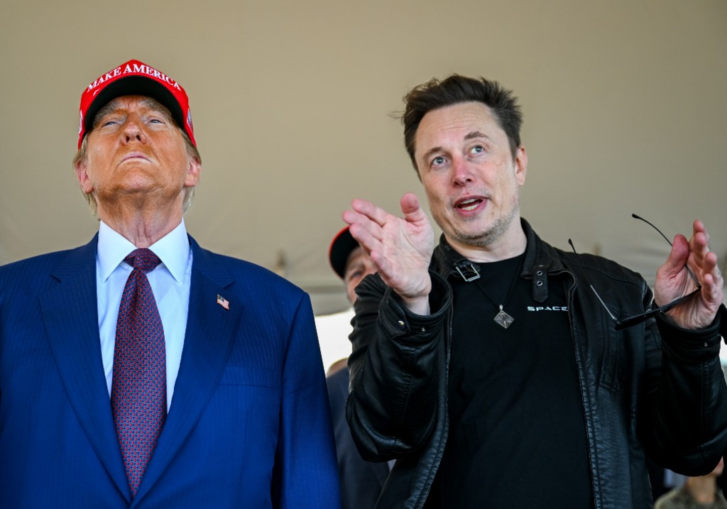Elon Musk speaks with U.S. President Donald Trump as they watch the launch of the sixth test flight of the SpaceX Starship rocket on November 19, 2024 in Brownsville, Texas.
