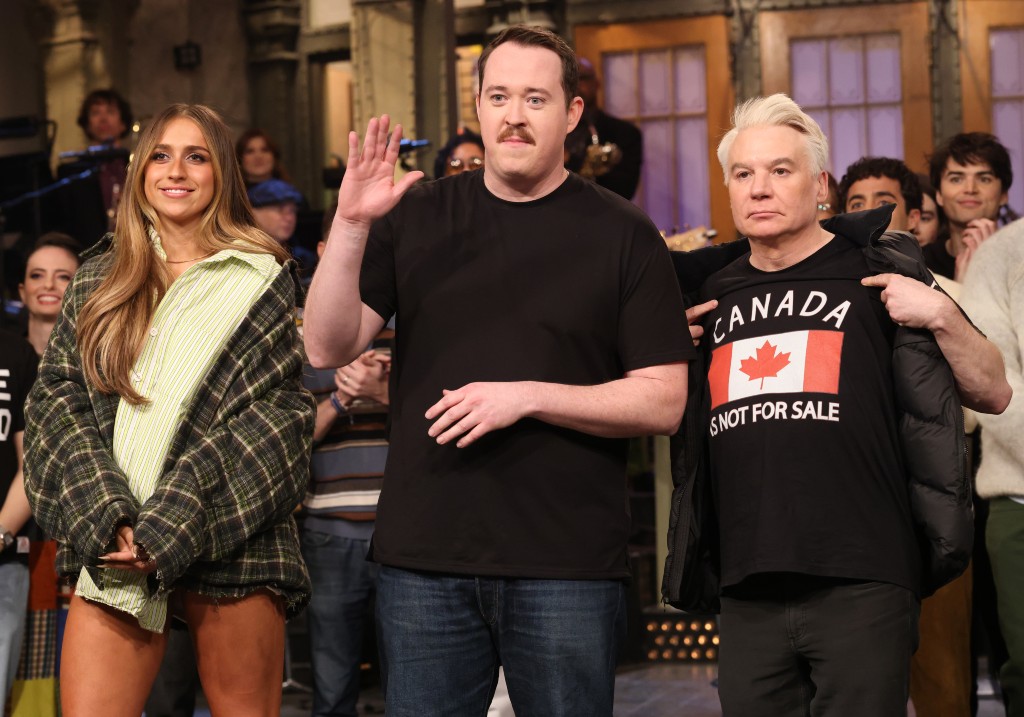 Musical guest Tate McRae of Calgary, host Shane Gillis, and special guest Mike Myers during say their goodnights after appearing on Saturday Night Live on March 1, 2025.