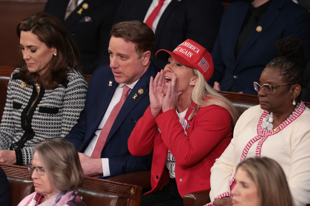 U.S. Rep. Marjorie Taylor Greene (R-GA) calls out as U.S. President Joe Biden delivers the State of the Union address during a joint meeting of Congress in the House chamber at the U.S. Capitol on March 07, 2024 in Washington, DC.