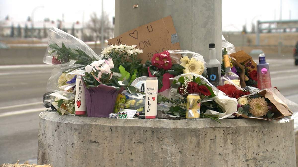 A memorial of flowers, messages and other tributes continues to grow at the scene of Wednesday's fatal crash on Crowchild Trail in Calgary.
