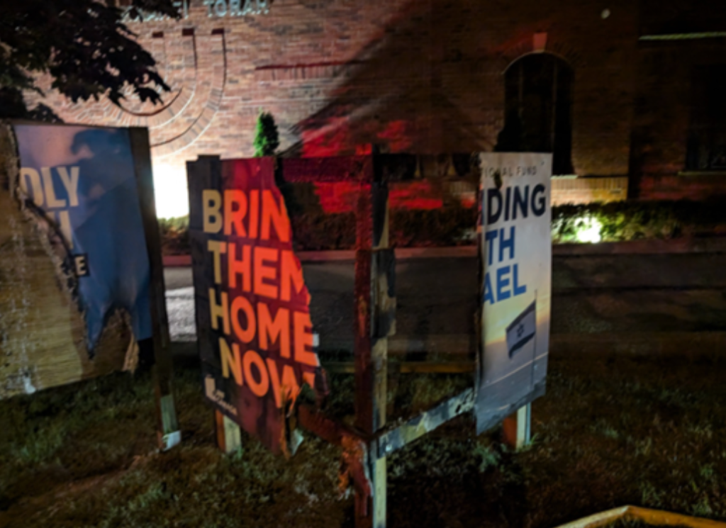 A sign supporting hostages of Hamas was torched outside Kehillat Shaarei Torah Synagogue, July 31, 2024.