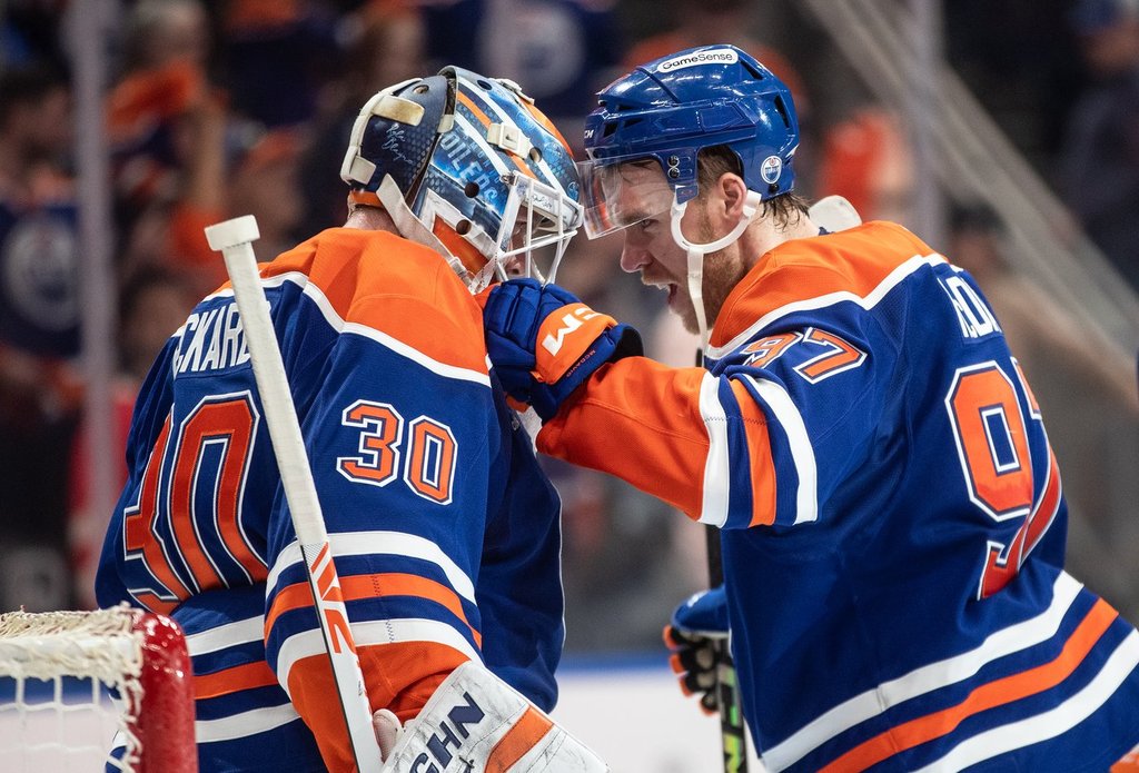 Edmonton Oilers goalie Calvin Pickard (30) and Connor McDavid (97) celebrate the win over the Los Angeles Kings in NHL playoff action in Edmonton on Friday, April 25, 2025.