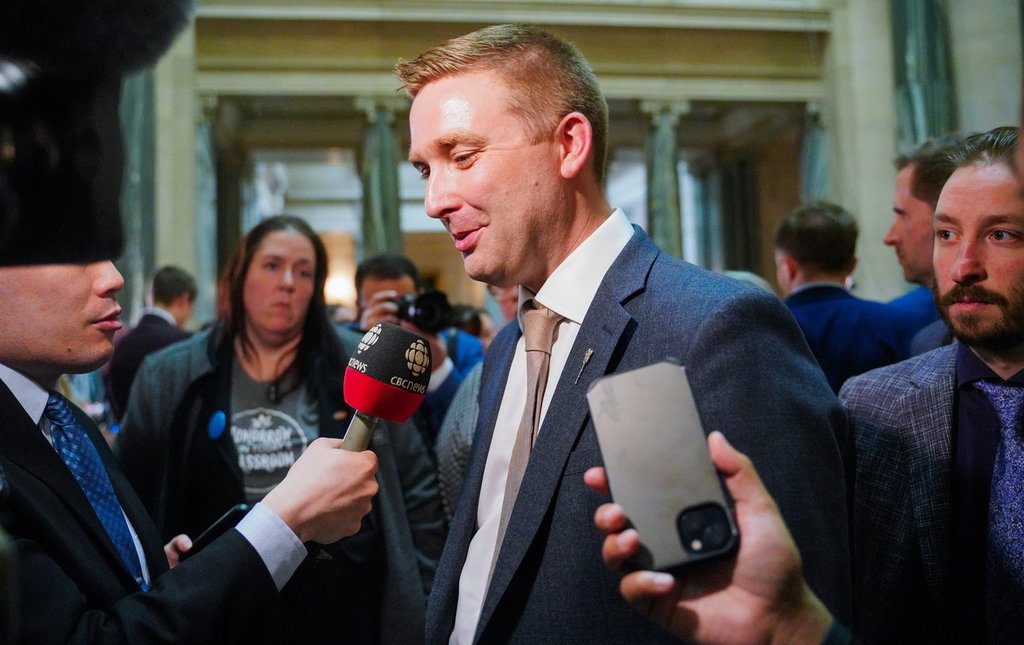 Saskatchewan Health Minister Jeremy Cockrill speaks to members of the media after the release of the Saskatchewan budget in Regina on March 20, 2024.