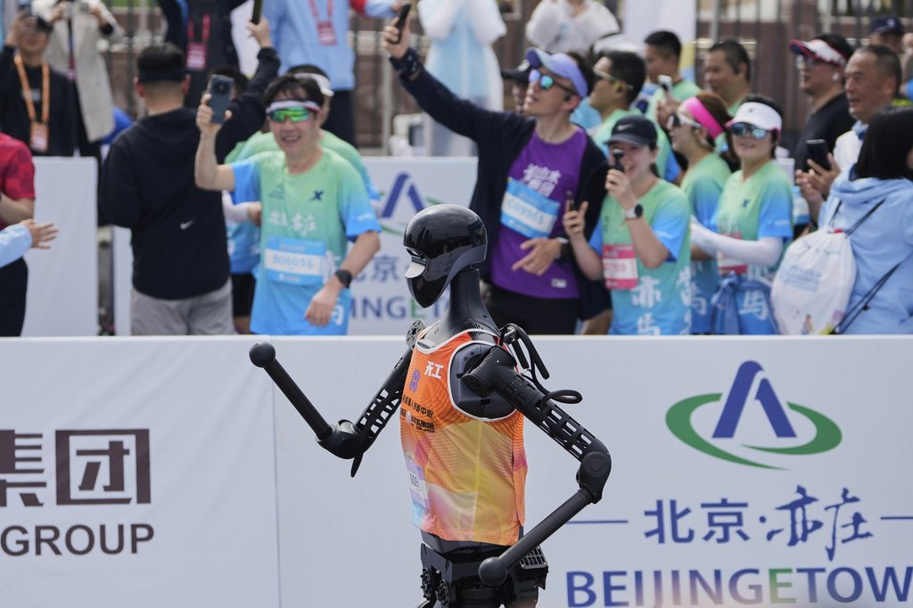 The Sky Project Ultra robot, also known as Tien Kung Ultra, crosses the finish line to win the Humanoid Robot Half-Marathon held in Beijing on Saturday, April 19, 2025. (AP Photo/Ng Han Guan)
