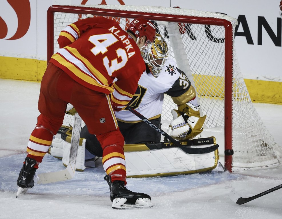 Vegas Golden Knights' goalie Ilya Samsonov (35) looks for the puck as Calgary Flames' Adam Klapka (43) hits the post during second period NHL hockey action in Calgary on Tuesday, April 15, 2025.