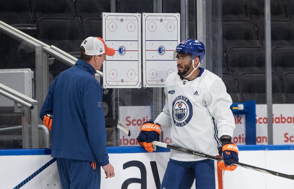 Edmonton Oilers' Evander Kane (91) talks with head coach Kris Knoblauch chat during practice before they take on the Florida Panthers in Thursday's game 3 of the NHL Stanley Cup playoffs in Edmonton on Wednesday June 12, 2024.