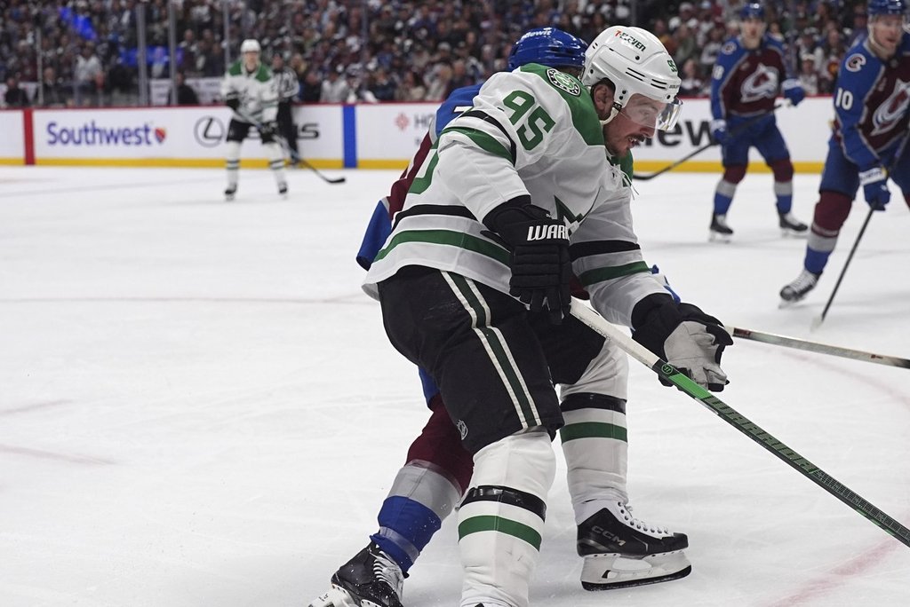 Dallas Stars centre Matt Duchene, front, drives past Colorado Avalanche defenceman Sam Malinski in the second period of Game 3 of an NHL hockey first-round playoff series Wednesday, April 23, 2025, in Denver.