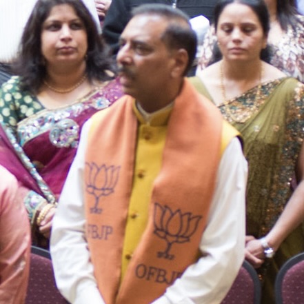 Man wearing OFBJP scarf at 2014 Overseas Friends of BJP Canada event in Toronto.