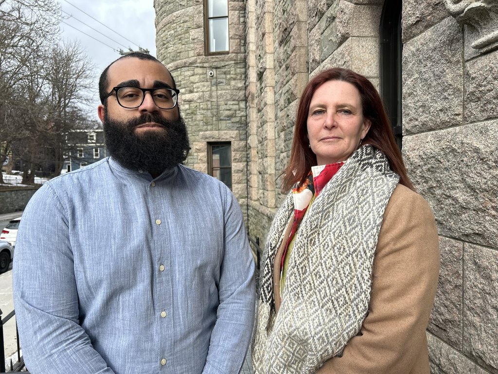 Whymarrh Whitby (left) and Alison Coffin stand outside the Newfoundland and Labrador Supreme Court building in St. John's on Monday, March 3, 2025. The two are involved in a lawsuit alleging the 2021 provincial election was riddled with irregularities that ultimately denied Whitby his right to vote.THE CANADIAN PRESS/Sarah Smellie.