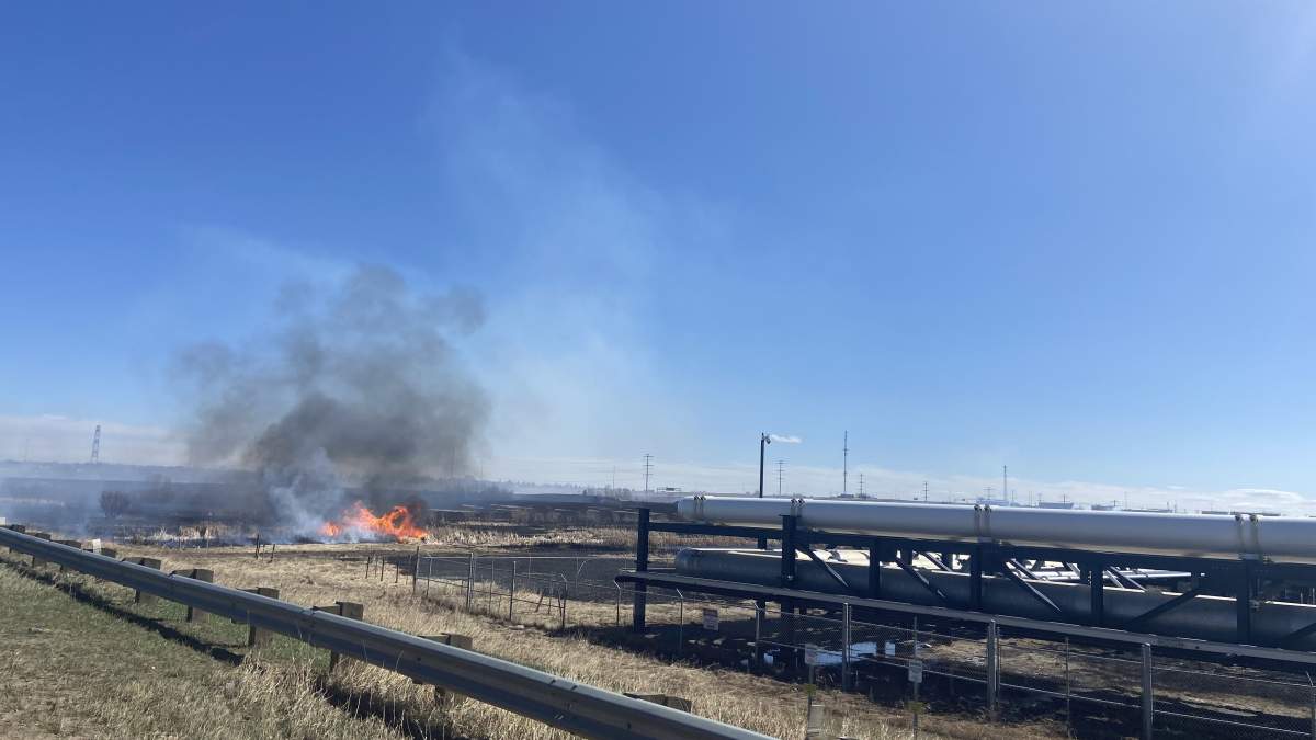 A fire burns near Baseline Road east of Edmonton on April 19, 2025.