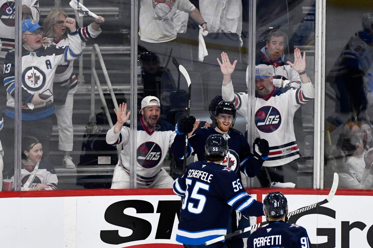 Winnipeg Jets' Kyle Connor (81) celebrates his goal against the St. Louis Blues with Mark Scheifele (55) during third period NHL playoff action in Winnipeg, Monday April 21, 2025. THE CANADIAN PRESS/Fred Greenslade.