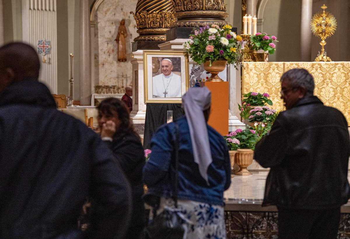 People attend a requiem mass in memory of Pope Francis at Mary Queen of the World Cathedral in Montreal on Tuesday, April 22, 2025.