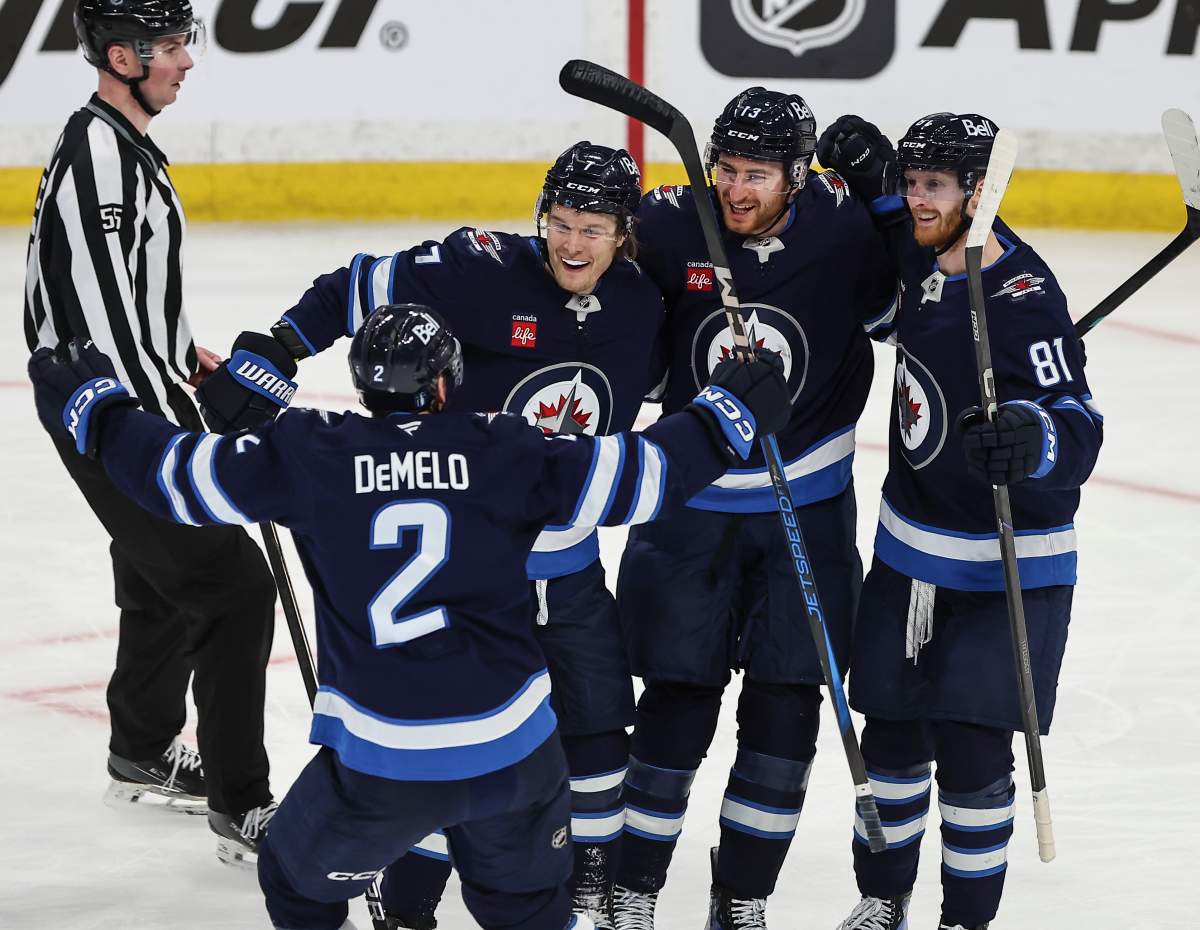 Winnipeg Jets' Dylan DeMelo (2), Vladislav Namestnikov (7), Gabriel Vilardi (13) and Kyle Connor (81) celebrate DeMelo's goal against the St. Louis Blues during second period NHL playoff action in Winnipeg on Wednesday, April 30, 2025. THE CANADIAN PRESS/John Woods.