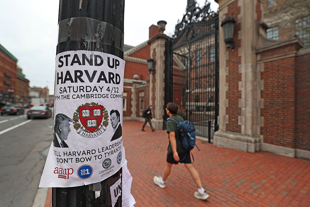 A poster for a protest on a telephone pole at Harvard University.