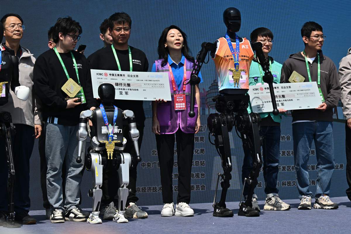 First placed Tiangong Ultra humanoid robot, second placed N2 humanoid robot developed by Noetix Robotics and third placed X02-lite humanoid robot developed by Shanghai Droid Robot Co., Ltd. attend the award ceremony following the Beijing E-town Half-Marathon and Humanoid Robot Half-Marathon on April 19, 2025 in Beijing, China.
