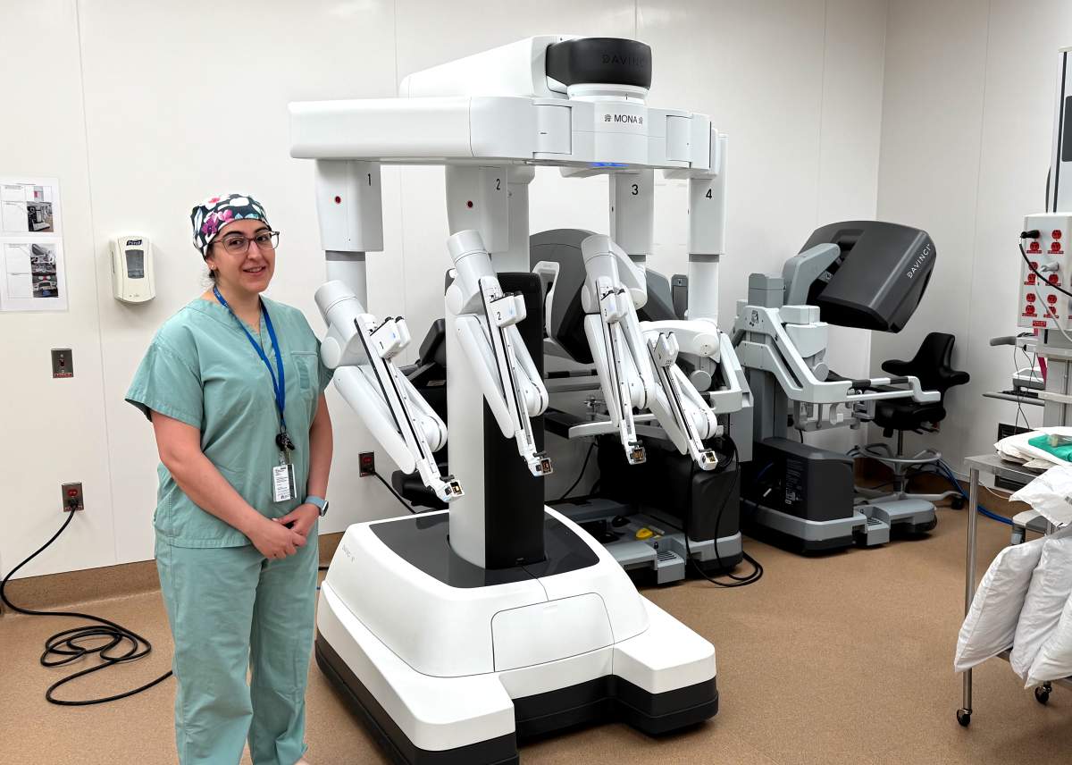 Dr. Gilly Akhtar stands next to the $3.5 million da Vinci Xi robot aquired by the Health Care Sciences Centre in Winnipeg.