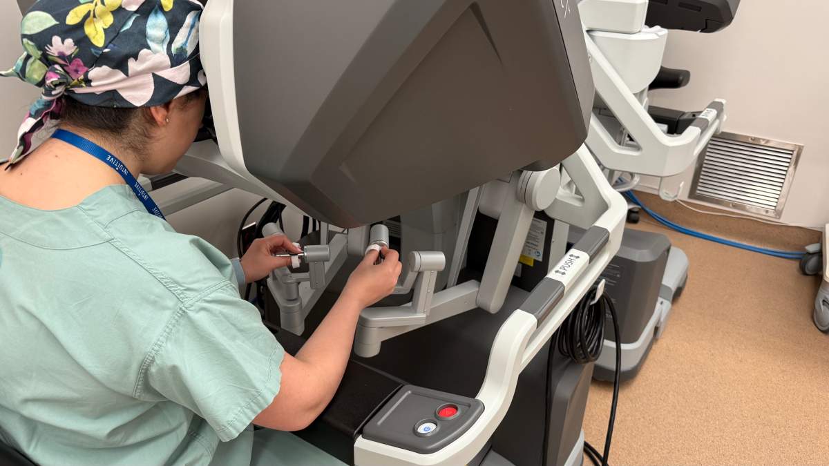 A surgeon shows how the controls work on the new surgical robot work.